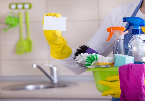 Carpet cleaning technician working safely with protective equipment in a home